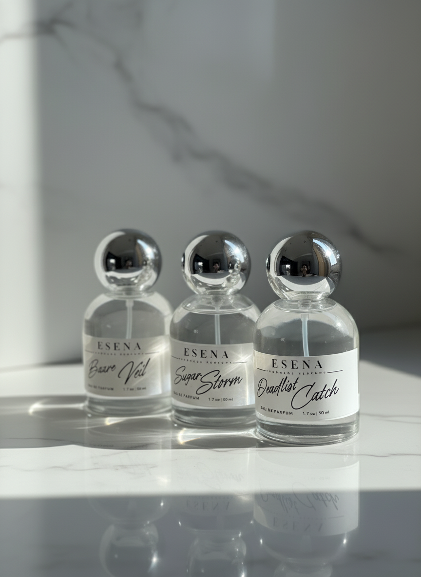 Three small perfume bottles labeled 'Esena' on a neutral background